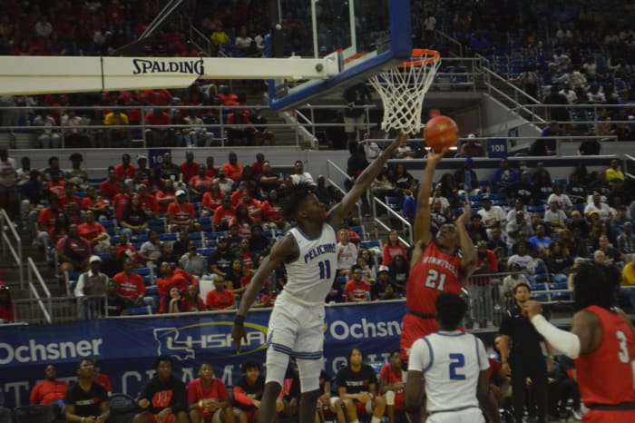 Port Allen junior Aries Lewis (11) attempts to block Winnfield senior Keithan Hamilton's shot during the Division III non-select championship game Saturday.